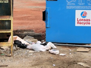 garbage outside recycling bin