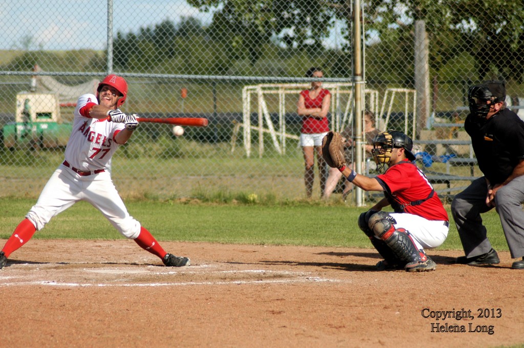 Rosetown Angel batter, Regan L'Heureux catcher for Cardinals, Adolph Fischer umpire