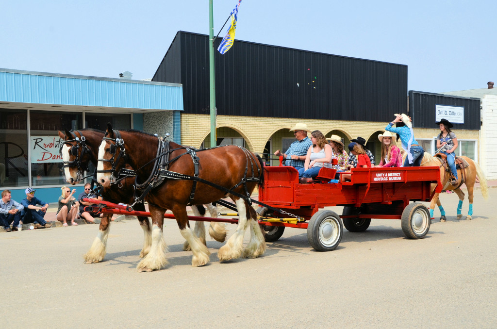 The rodeo queen candidates rode in Pat Uzelman's Clyde-drawn wagon.